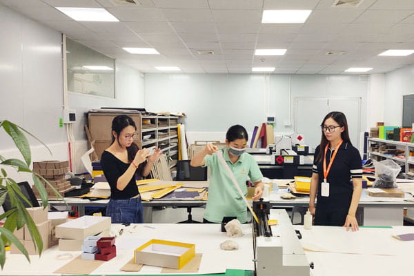 Developing a packaging sample at a Chinese factory in the sample room